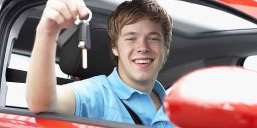 Teenage Boy Sitting In Car Holding Car Keys